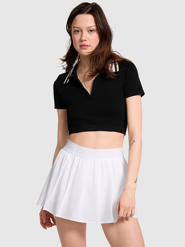 PINK Tech Stretch Pleated Tennis Skort, White/Ivory, onModelFront, 1 of 4 Sofia is 5'10" and wears Small
