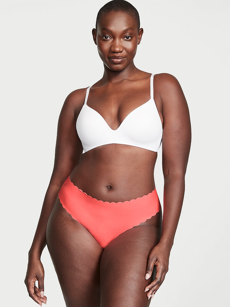 Victoria's Secret, No-Show No-Show Thong Panty, Coral Blaze, onModelFront, 1 of 3 Arame is 5'11" and wears Large