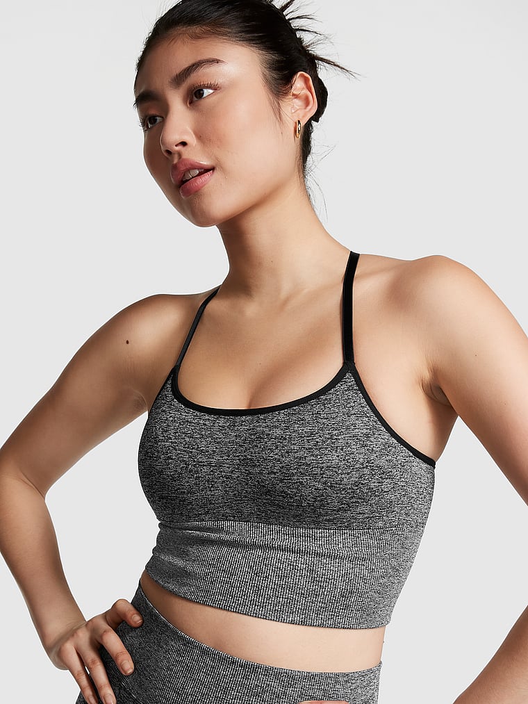 PINK Pink Active Seamless Air Low-Impact Sports Bra, Pure Black Marl, onModelFront, 1 of 4 Gloria is 5'9" and wears 34D or Small